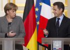Merkel y Sarkozy amenazan con bloquear el rescate de Atenas