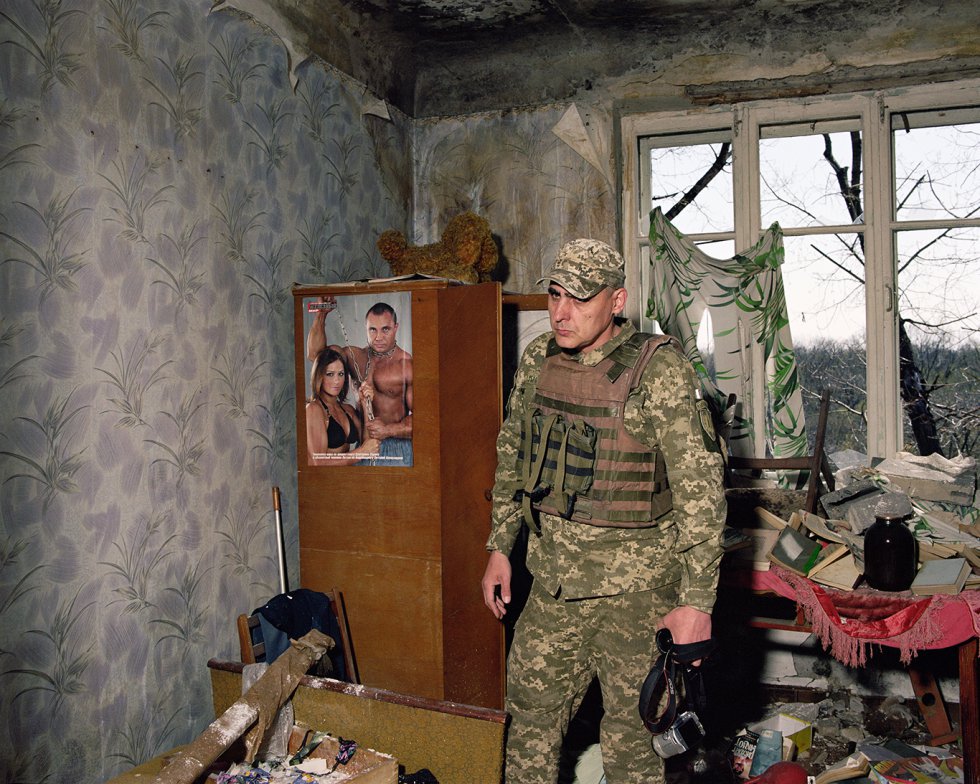 Oficial de la armada in un apartamento bombardeado, Zolote, 2019.